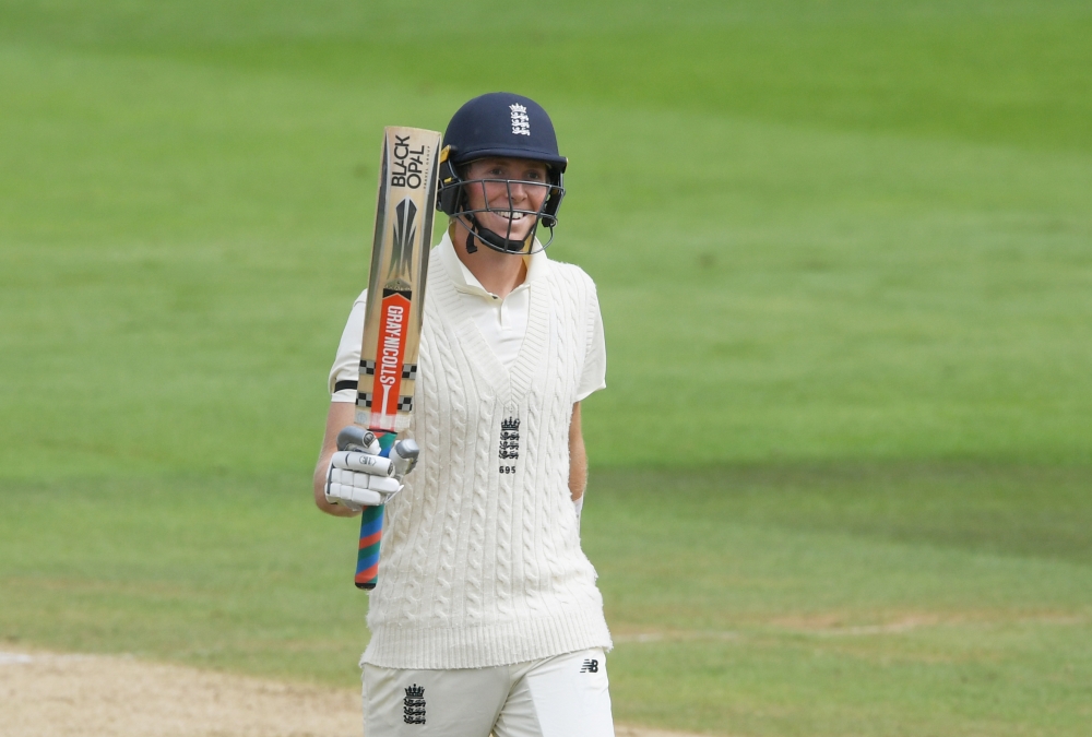 August 21, 2020 England's Zak Crawley celebrates his half century, as play resumes behind closed doors following the outbreak of the coronavirus disease (COVID-19) Mike Hewitt/Pool via REUTERS