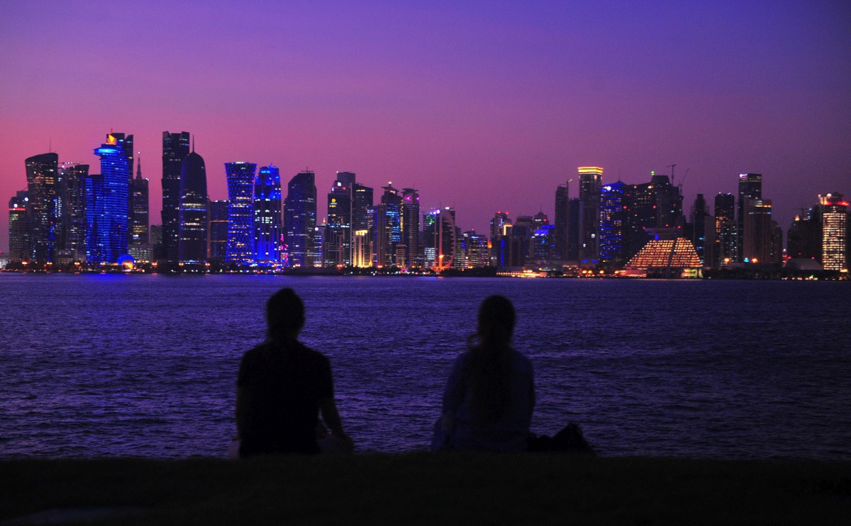 Two women enjoying the view of Doha skyline from MIA Park. Photo: Abdul Basit/The Peninsula
