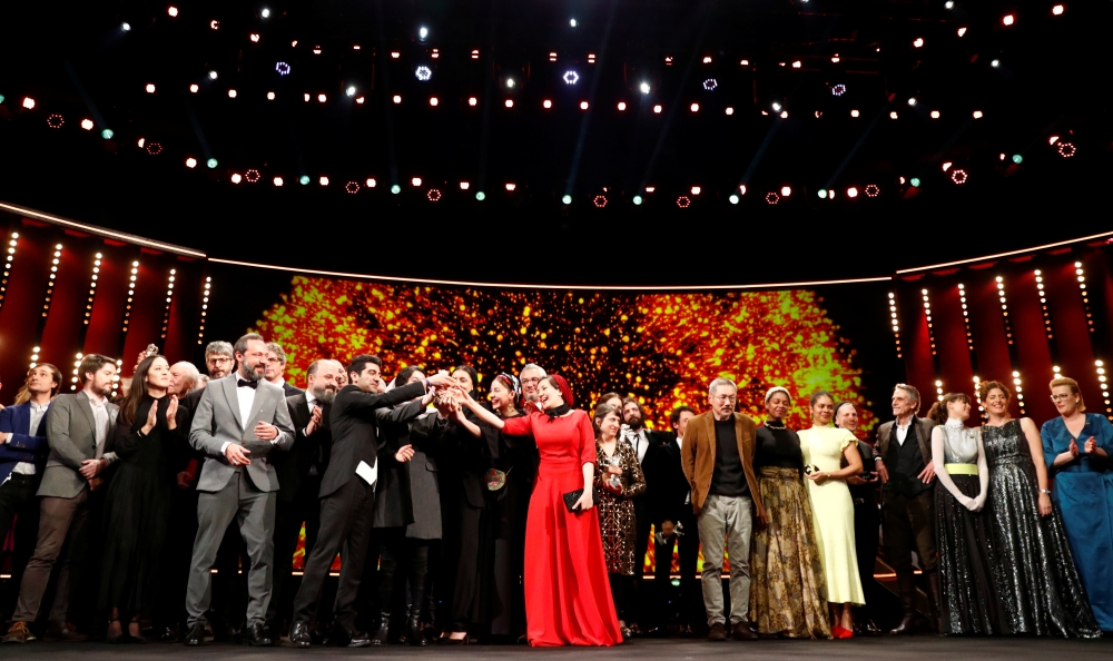 The awarded pose for a family picture after the awards ceremony at the 70th Berlinale International Film Festival in Berlin, Germany, February 29, 2020. REUTERS/Fabrizio Bensch/File Photo