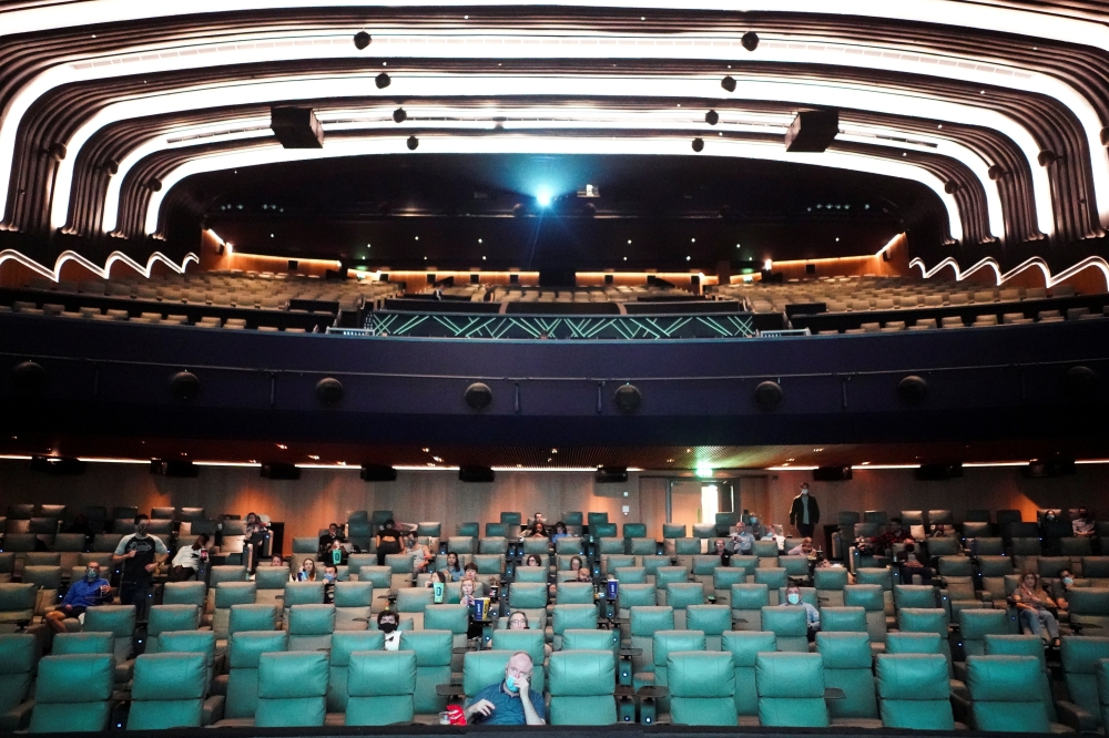 People take their seats inside the Odeon Luxe Leicester Square cinema, on the opening day of the film 