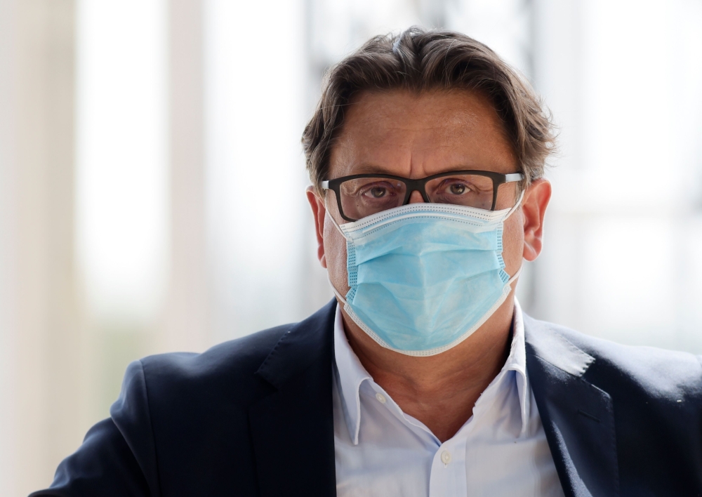 Chief Executive Officer of French pharmaceutical group Sanofi Paul Hudson wearing a face mask during a session of the employers' association Medef' s summer meeting at the Longchamp horse racetrack in Paris on August 27, 2020. / AFP / ERIC PIERMONT