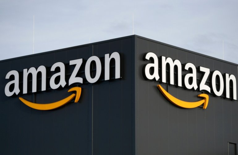 In this file photo taken on December 17, 2019 this picture shows the logo of US online retail giant Amazon at the distribution center in Moenchengladbach, western Germany. / AFP / INA FASSBENDER