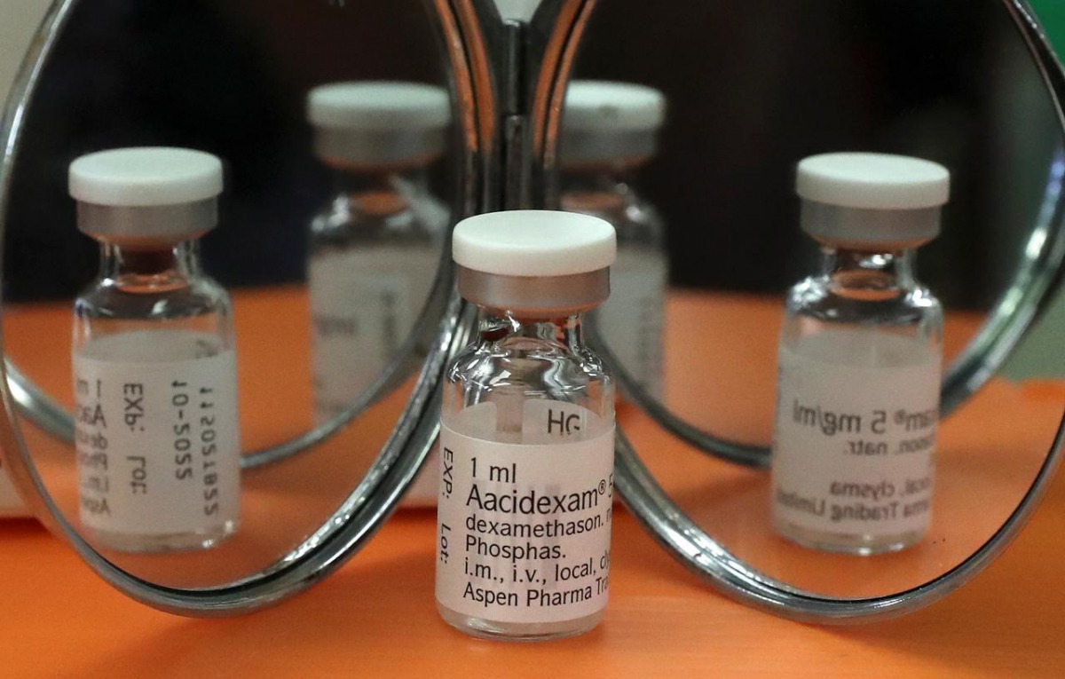 FILE PHOTO: An ampoule of Dexamethasone is seen during the coronavirus disease (COVID-19) outbreak in this picture illustration taken June 17, 2020. REUTERS/Yves Herman/Illustration
