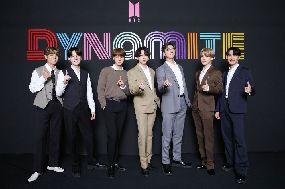 This handout photo taken in Seoul on September 2, 2020 and provided by Big Hit Entertainment shows K-pop group BTS members posing for a photo as they hold an online global media day. 