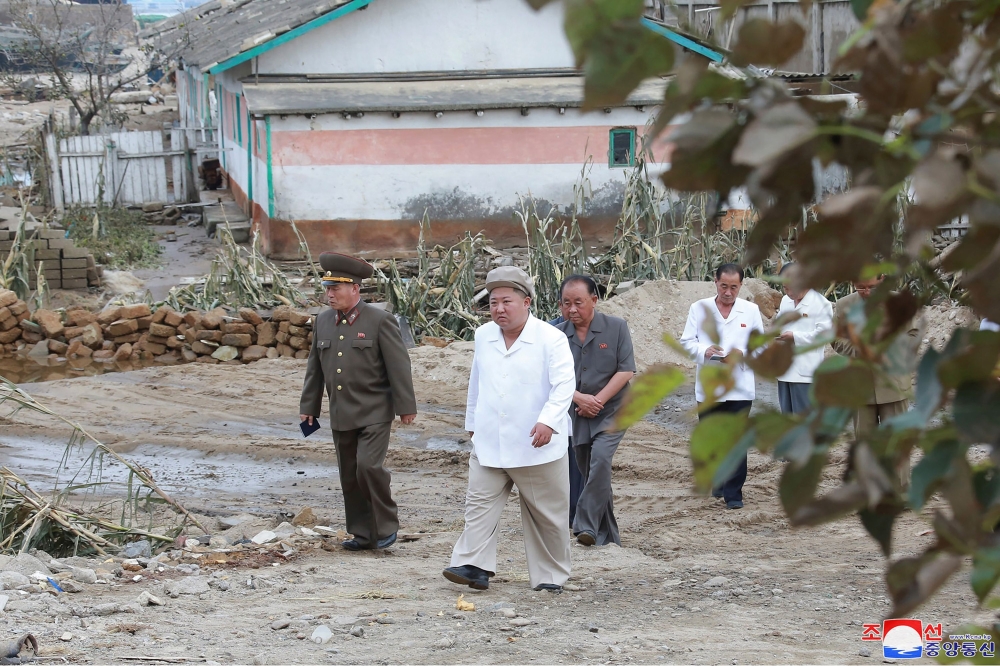 In this picture taken on September 5, 2020 and released from North Korea's official Korean Central News Agency (KCNA) on September 6, 2020 shows North Korean leader Kim Jong Un (2nd L) visiting the damaged area made by Typhoon Maysak at South Hamgyong Pro