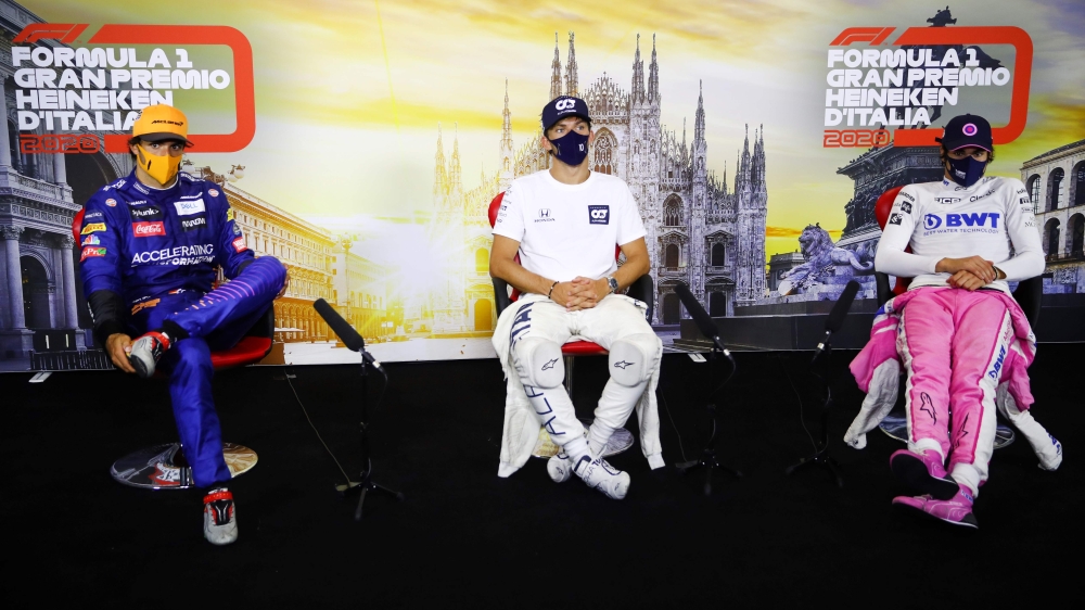 Winner AlphaTauri's French driver Pierre Gasly (C), second-placed McLaren's Spanish driver Carlos Sainz Jr (L), and third-placed Racing Point's Canadian driver Lance Stroll (R) attend a press conference after the Italian Formula One Grand Prix at the Auto