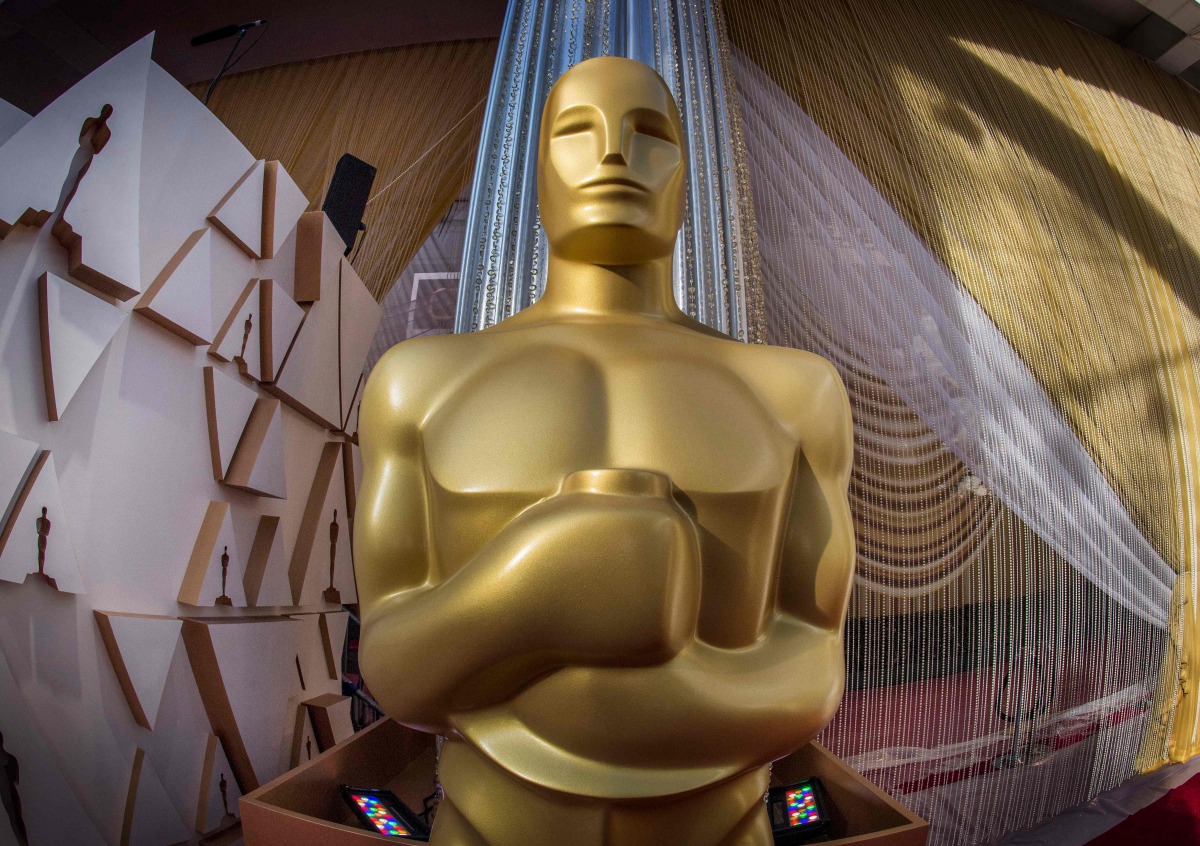 (FILES) In this file photo taken on February 8, 2020 an oscars statue is displayed on the red carpet area on the eve of the 92nd oscars ceremony at the Dolby Theatre in Hollywood, California. Hollywood's motion picture academy unveiled strict new eligibil