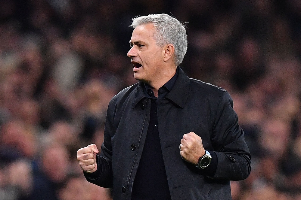In this file photo taken on November 26, 2019 Tottenham Hotspur's Portuguese head coach Jose Mourinho celebrates as Tottenham Hotspur's English striker Harry Kane (unseen) scores his team's second goal during the UEFA Champions League Group B football mat
