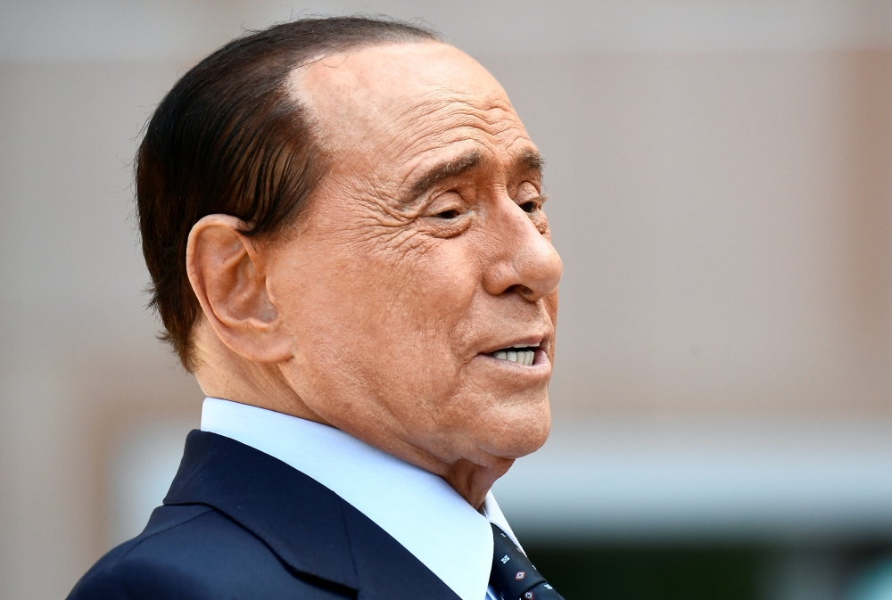 Former Italian Prime Minister Silvio Berlusconi speaks to the media as he leaves Milan's San Raffaele hospital, where he was being treated after testing positive for the coronavirus disease (COVID-19) and diagnosed with mild pneumonia, in Milan, Italy, Se