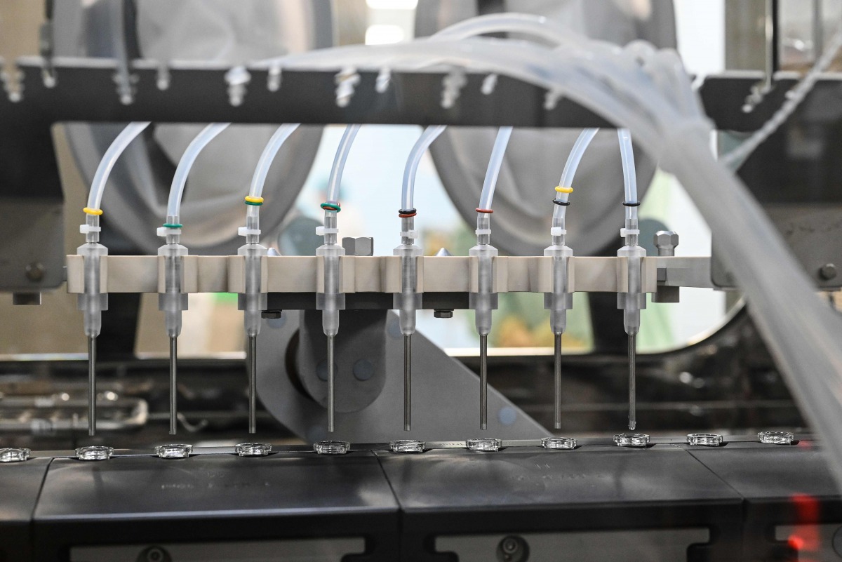 Filling and packaging tests for the large-scale production and supply of the University of Oxford’s COVID-19 vaccine candidate, AZD1222, are being conducted on a high-performance aseptic vial filling line on September 11, 2020 at the Italian biologics’ ma