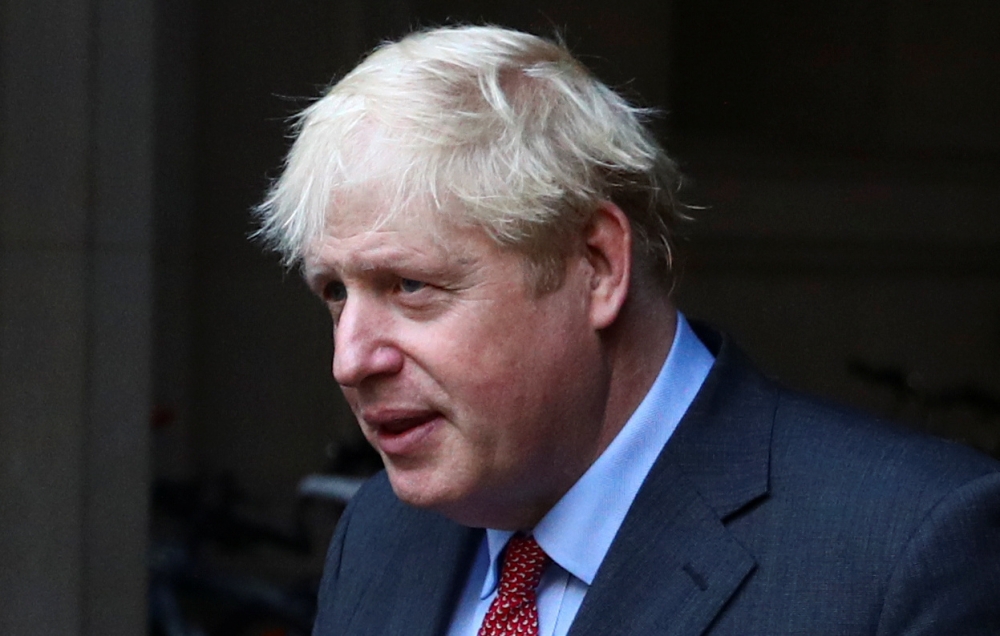 Britain's Prime Minister Boris Johnson leaves after a cabinet meeting, in London, Britain, September 22, 2020. REUTERS/Hannah McKay