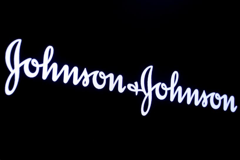 FILE PHOTO: The company logo for Johnson & Johnson is displayed on a screen to celebrate the 75th anniversary of the company's listing at the New York Stock Exchange (NYSE) in New York, U.S., September 17, 2019. REUTERS/Brendan McDermid/File Photo