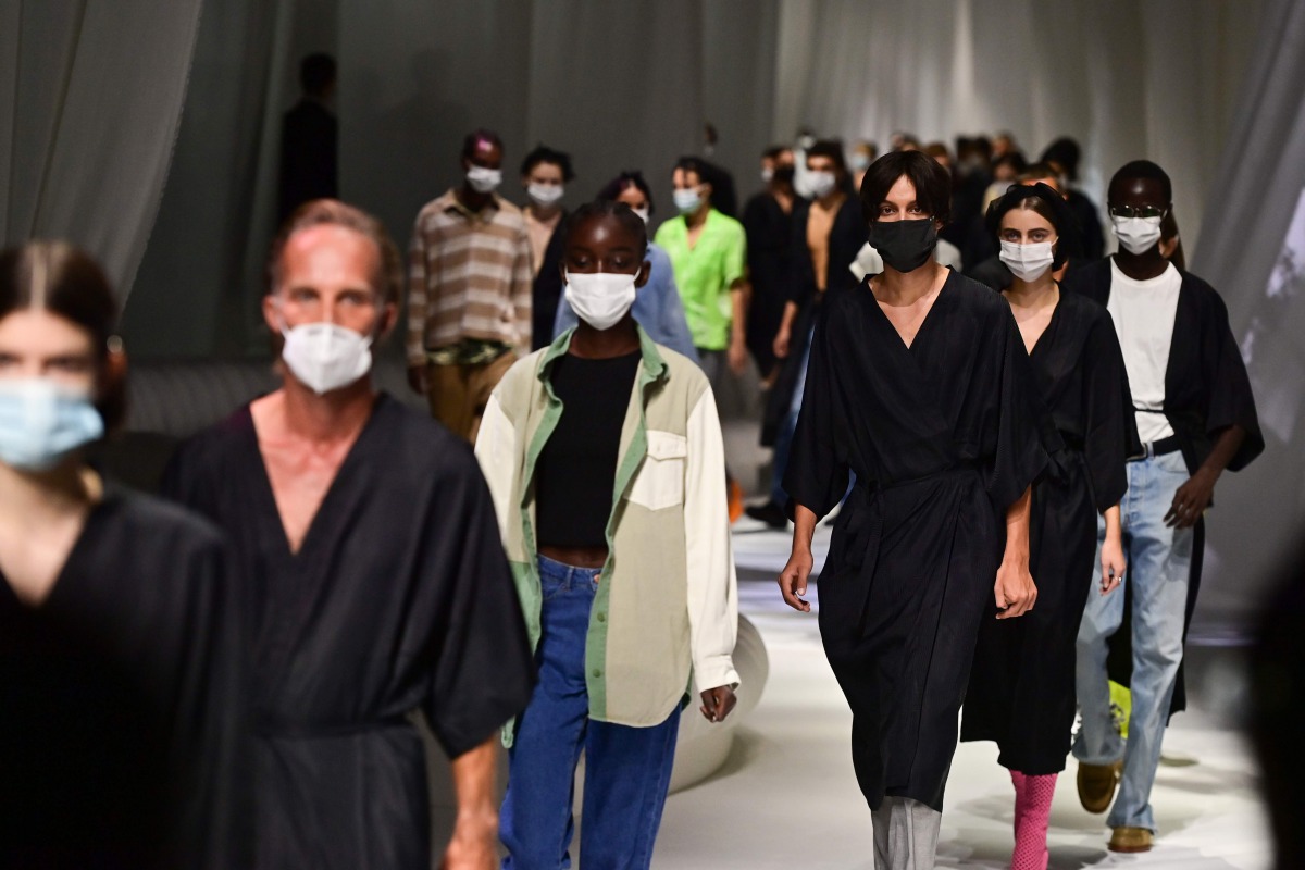 Models wearing protective masks are pictured during the rehearsal prior Fendi's Spring/Summer 2021 women's and mens collection during the Milan Fashion Week, on September 23, 2020. / AFP / MIGUEL MEDINA
