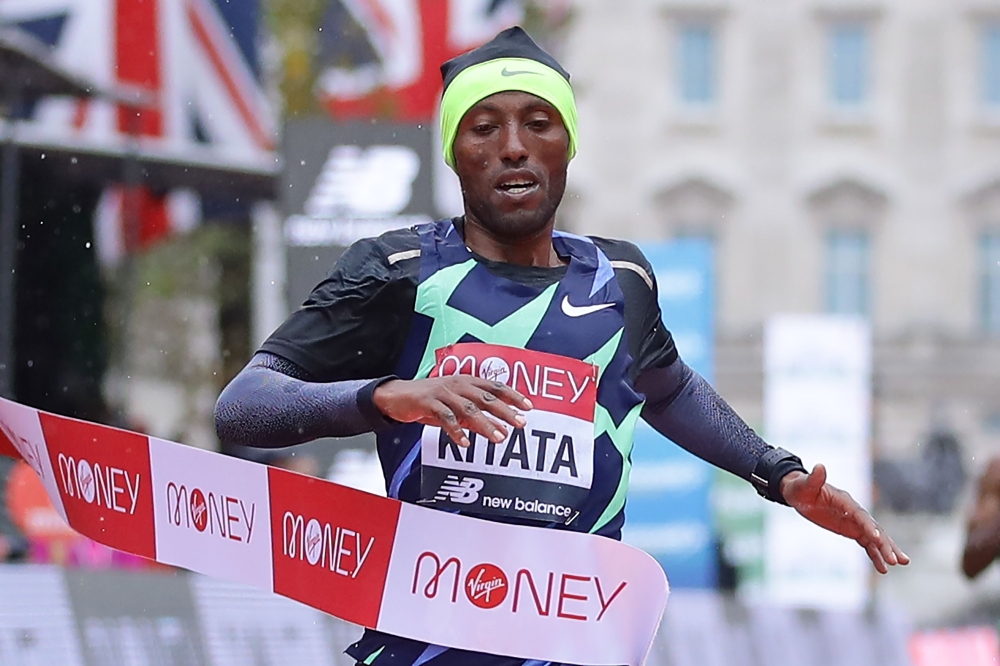 Ethiopia's Shura Kitata breaks the tape as he wins the elite men's race of the 2020 London Marathon in central London on October 4, 2020. This year's London marathon, an elite-athlete only event, takes place in a 