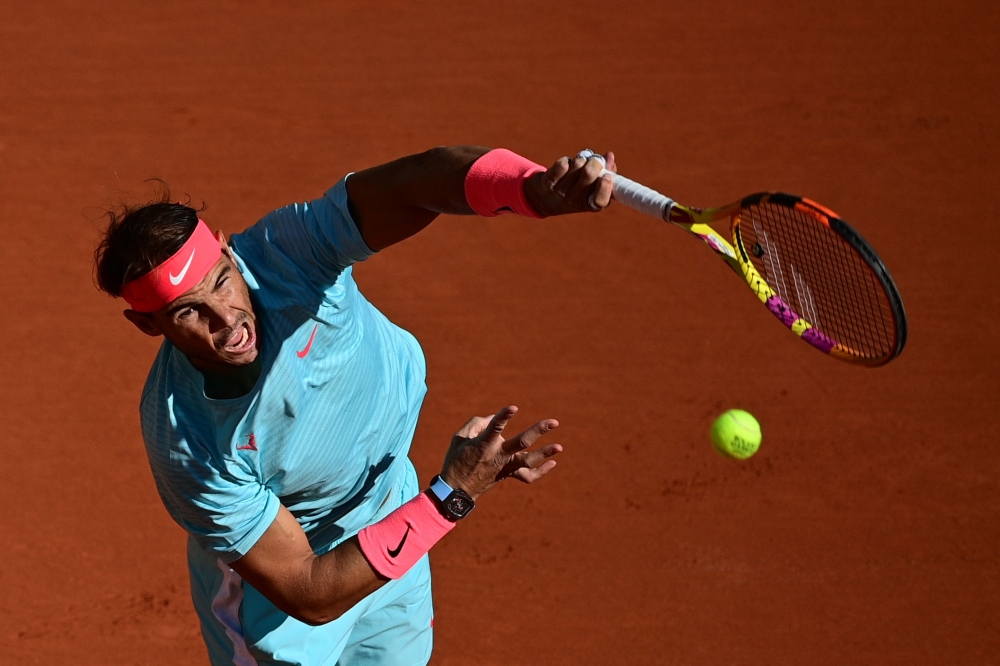 Spain's Rafael Nadal serves the ball to Sebastian Korda of the US during their men's singles fourth round tennis match on Day 8 of The Roland Garros 2020 French Open tennis tournament in Paris on October 4, 2020. / AFP / MARTIN BUREAU