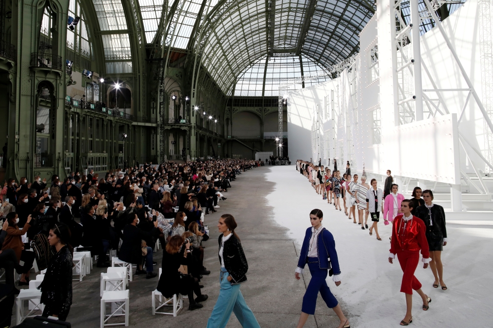 Models present creations by designer Virginie Viard as part of her Spring/Summer 2021 ready-to-wear collection show for fashion house Chanel during Paris Fashion Week in Paris, France, October 6, 2020. REUTERS/Benoit Tessie