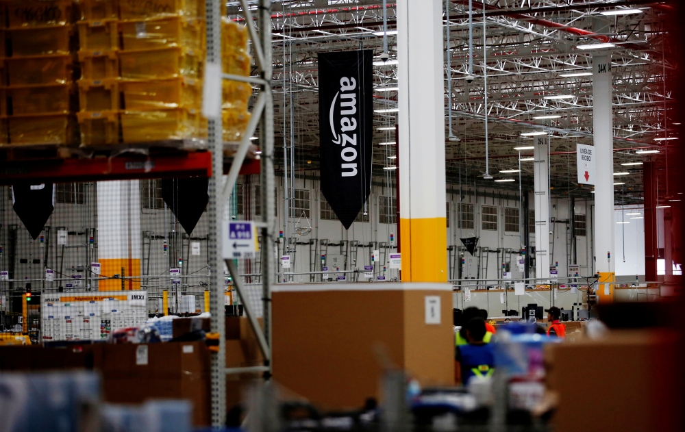 The logo of Amazon is seen at their new Amazon warehouse during its opening announcement on the outskirts of Mexico City, Mexico July 30, 2019. Picture taken July 30 2019. REUTERS/Carlos Jasso/File Photo