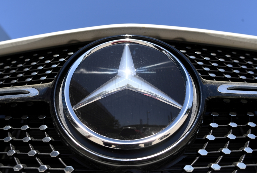 The Mercedes-Benz logo is seen near the Daimler headquarters In Stuttgart, Germany, April 22, 2020. REUTERS/Andreas Gebert/File Photo/File Photo
