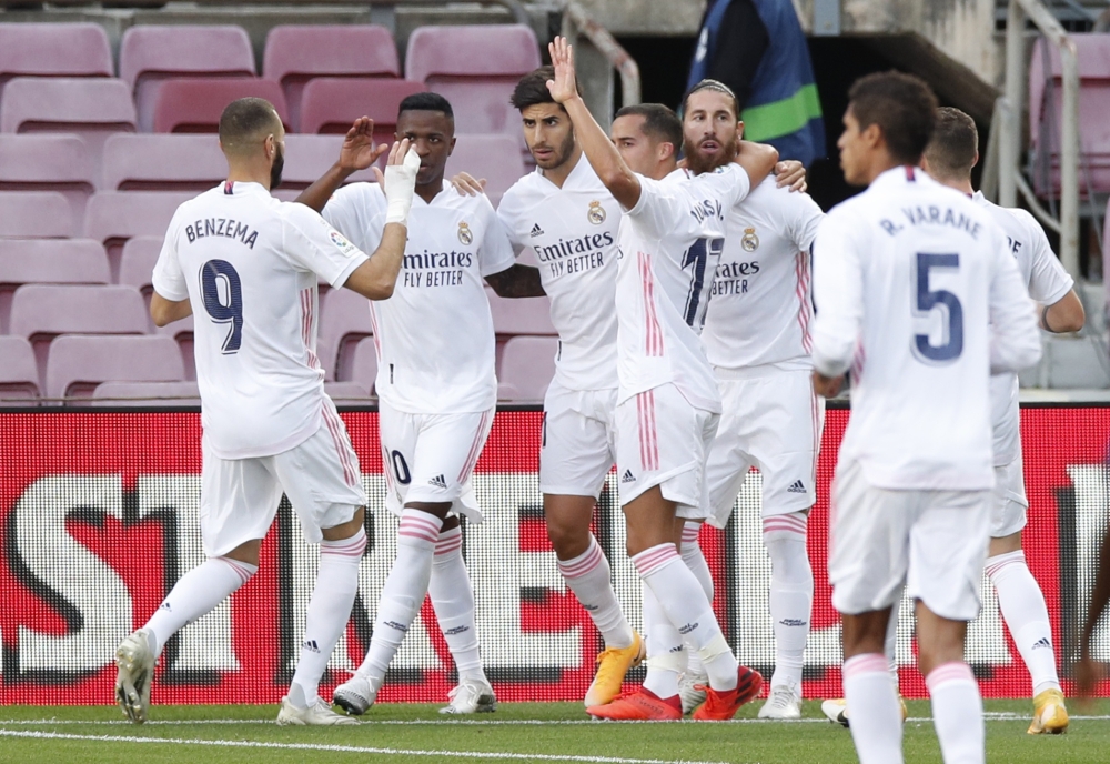 Real Madrid's Sergio Ramos celebrates scoring their second goal with teammates REUTERS/Albert Gea
