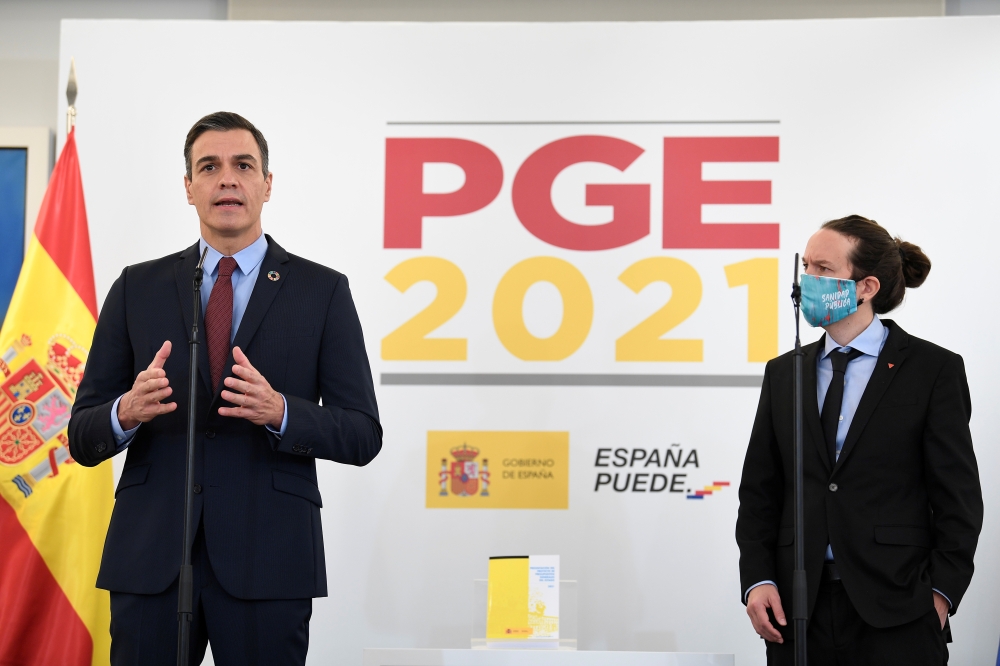 Spanish Prime Minister Pedro Sanchez and Spanish second Deputy Prime Minister Pablo Iglesias attend a presentation of the 2021 draft budget at Moncloa Palace in Madrid, Spain, October 27, 2020. Moncloa Palace/Borja Puig de la Bellacasa/Handout via REUTERS