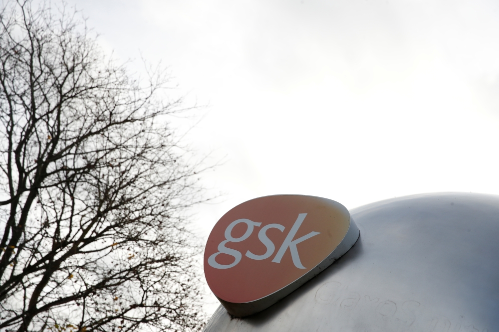 Company logo of pharmaceutical company GlaxoSmithKline is seen at their Stevenage facility, Britain October 26, 2020. REUTERS/Matthew Childs
