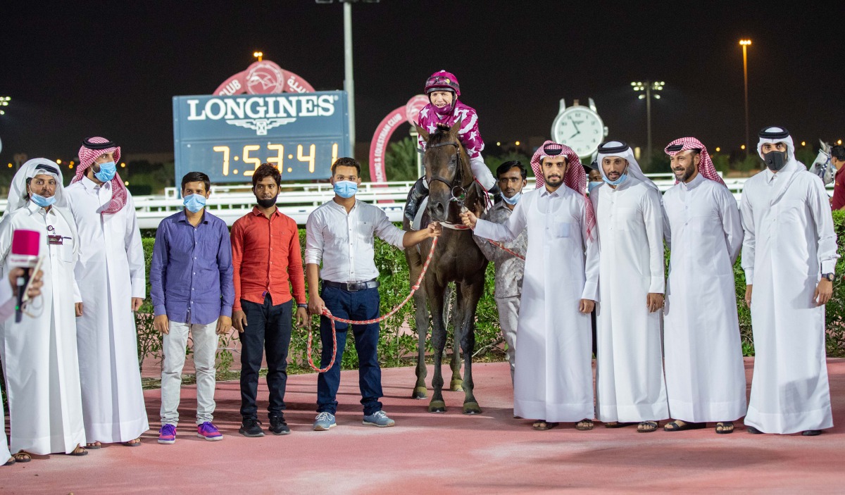 Qatar Cup winners pose for a group picture. 