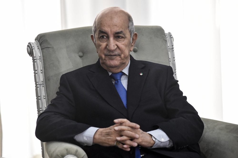 (FILES) In this file photo taken on January 21, 2020, Algerian President Abdelmadjid Tebboune meets with the visiting France's foreign minister in the capital Algiers. / AFP / RYAD KRAMDI