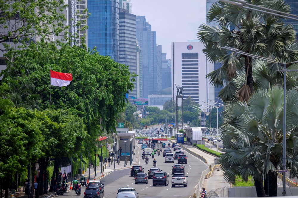 Light traffic along the main road in central Jakarta after months of the government's policy implementing work from home. / AFP / BAY ISMOYO