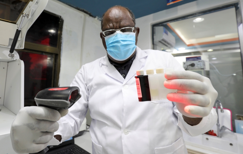 Laboratory technician Abdilelah Elnour Omer works inside the Medipark Diagnostics Lab that runs tests for the coronavirus disease (COVID-19), in Mogadishu, Somalia October 13, 2020. Picture taken October 13, 2020. REUTERS/Feisal Omar