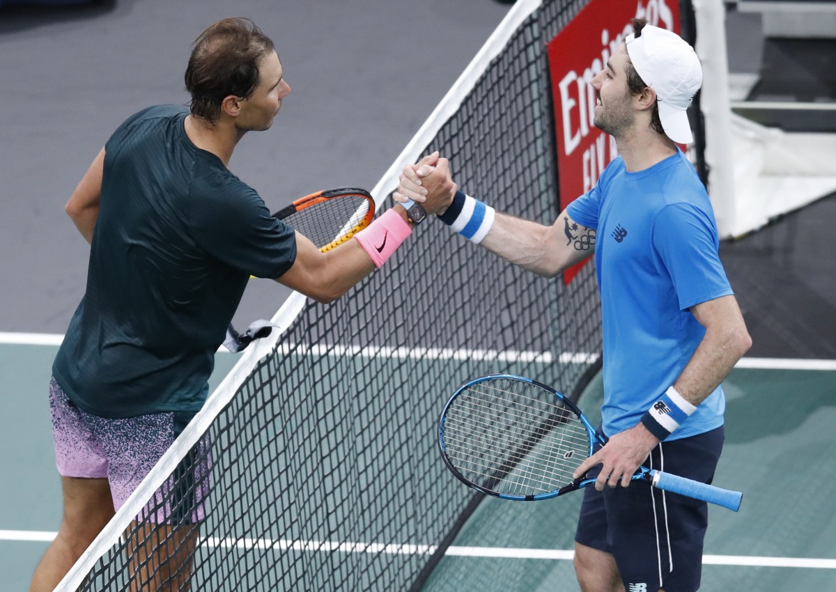 Tennis - ATP Masters 1000 - Paris Masters - AccorHotels Arena, Paris, France - November 5, 2020 Spain's Rafael Nadal shakes hands with Australia's Jordan Thompson as he celebrates winning their third round match REUTERS/Gonzalo Fuentes
