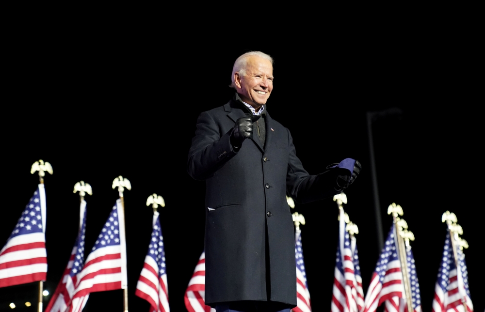 FILE PHOTO: Democratic U.S. presidential nominee and former Vice President Joe Biden smiles during a drive-in campaign rally at Heinz Field in Pittsburgh, Pennsylvania, U.S., November 2, 2020. REUTERS/Kevin Lamarque
