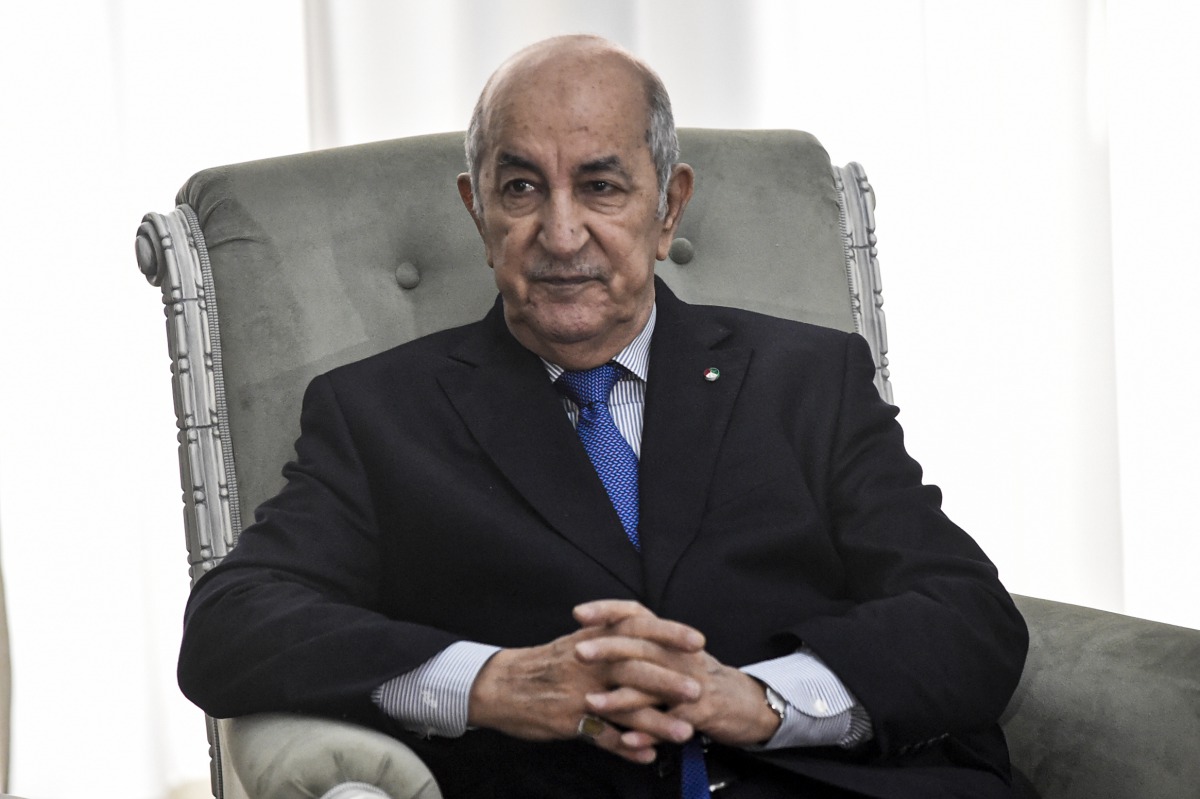 (FILES) In this file photo taken on January 21, 2020, Algerian President Abdelmadjid Tebboune meets with the visiting France's foreign minister in the capital Algiers. The Algerian presidency confirmed on November 3, 2020 that Abdelmadjid has Covid-19./ A
