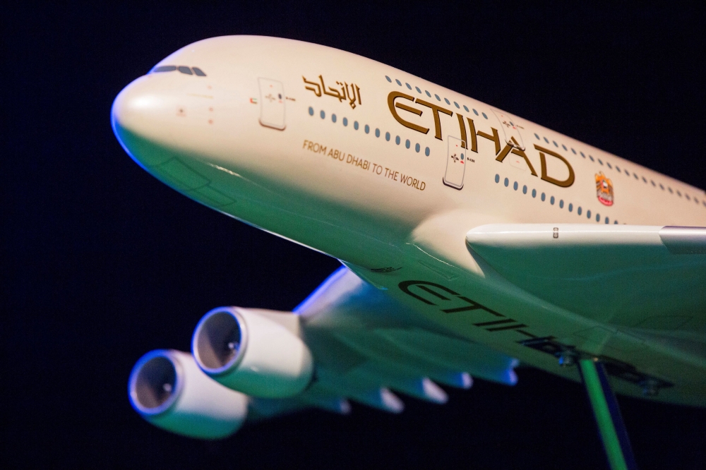 A model Etihad Airways plane is seen on stage in New York, U.S. November 13, 2014. REUTERS/Lucas Jackson/File Photo