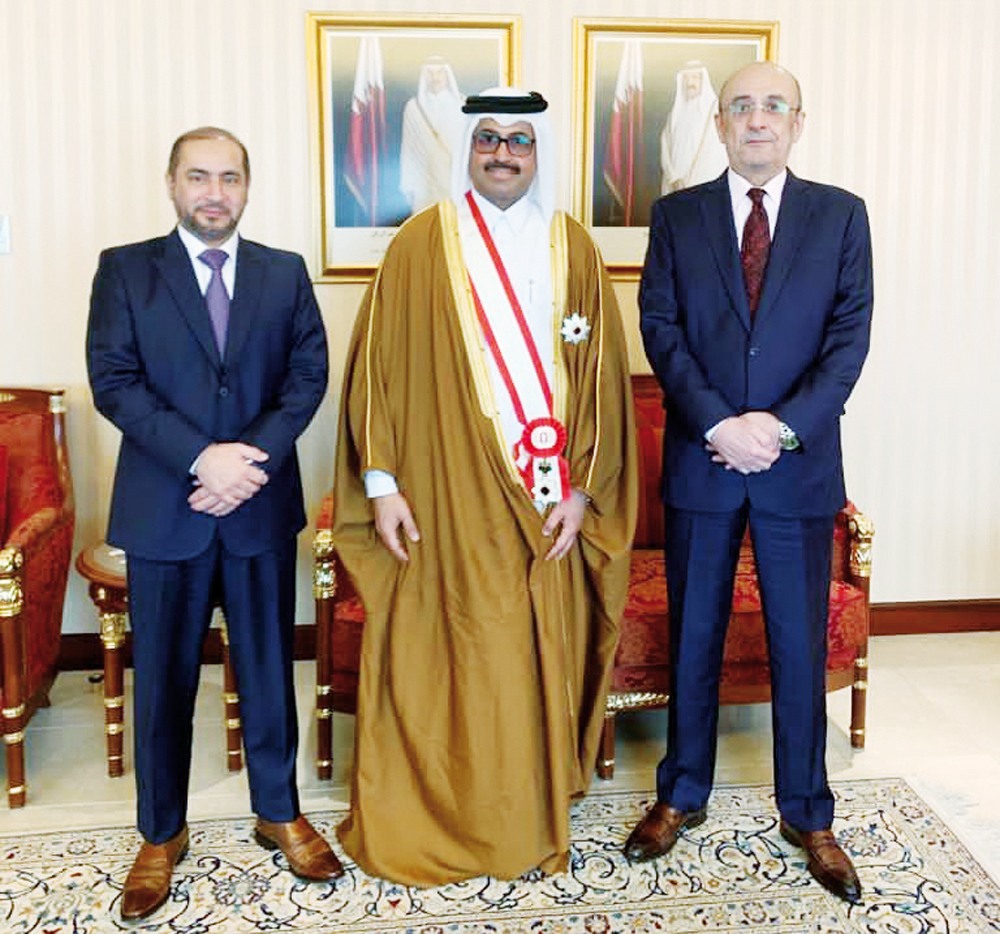 H E Dr. Mohammed bin Saleh Al Sada with officials during the event.