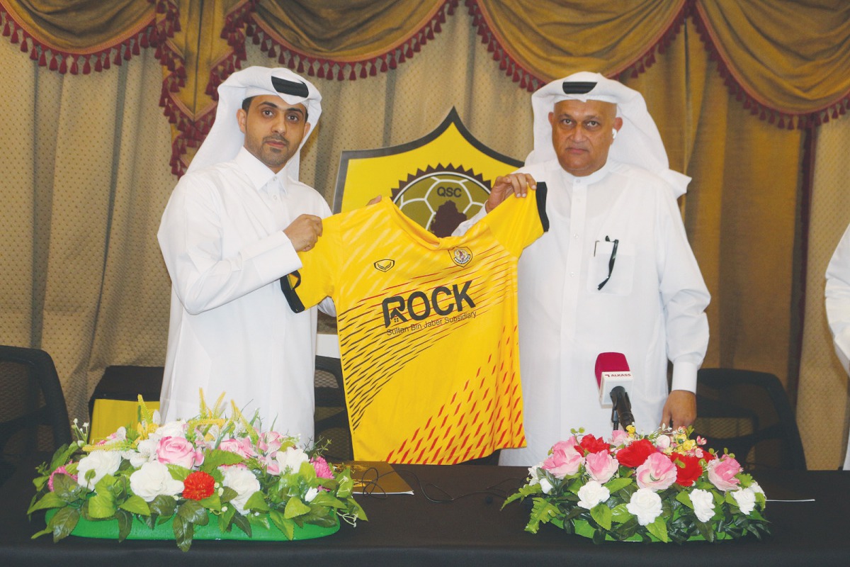 Qatar Sports Club and Rock Real Estate Investment Company representatives during the sponsorship signing ceremony.