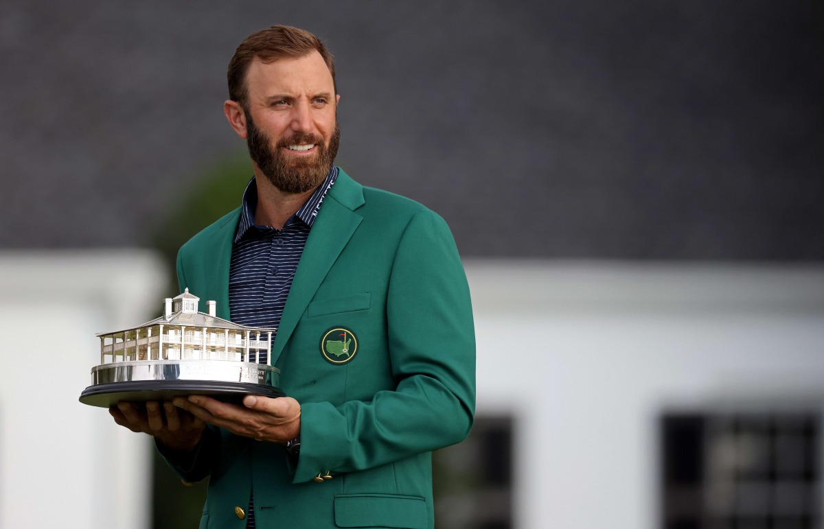 AUGUSTA, GEORGIA - NOVEMBER 15: Dustin Johnson of the United States poses with the Masters Trophy during the Green Jacket Ceremony after winning the Masters at Augusta National Golf Club on November 15, 2020 in Augusta, Georgia. Rob Carr/Getty Images/AFP