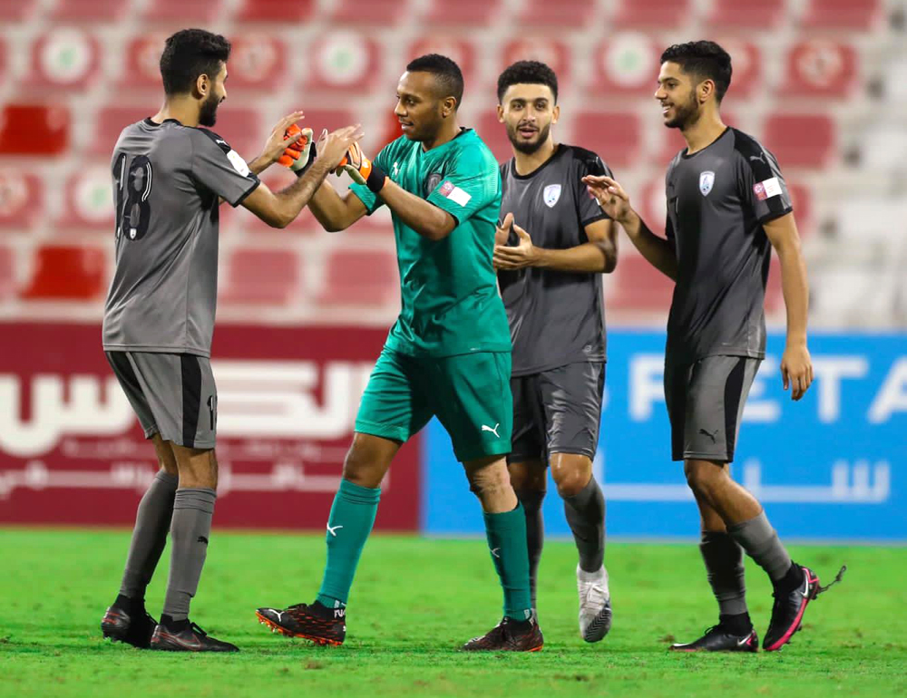 Al Wakrah's goalkeeper Saoud Mubarak Al Khater (second left) celebrates with team-mates after a blocking a penalty during yesterday's quarter-final. 