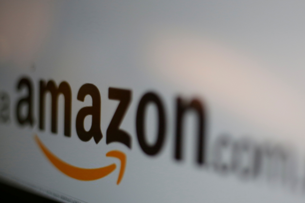 FILE PHOTO: The logo of Amazon.com is pictured in this June 8, 2017 illustration photo. REUTERS/Carlos Jasso/Illustration