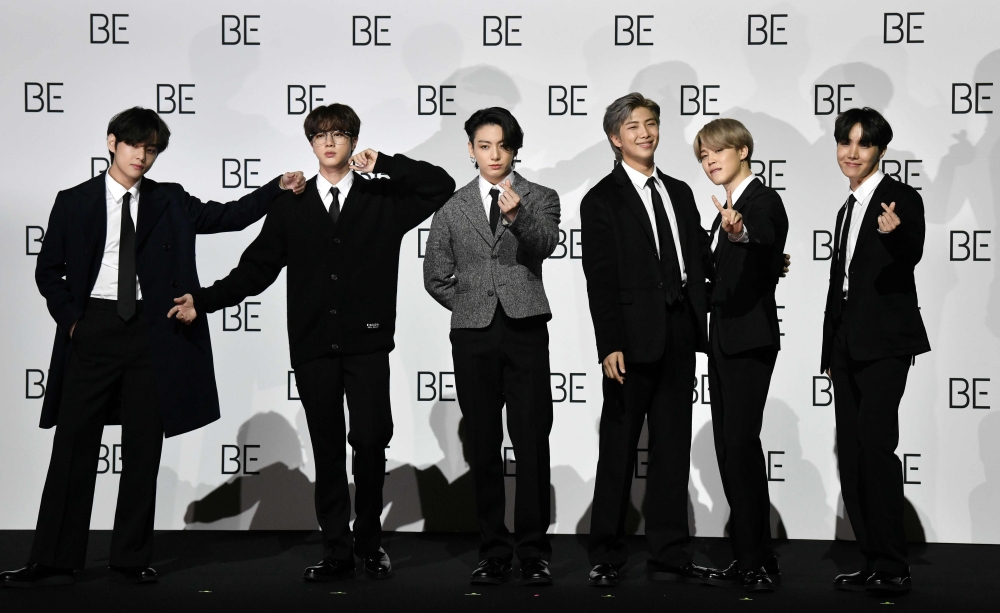 South Korean K-pop boy band BTS members (L to R) V, Jin, Jung Kook, RM, Jimin and J-Hope pose for a photo session during a press conference on BTS new album 'BE (Deluxe Edition)' in Seoul on November 20, 2020. / AFP / Jung Yeon-je