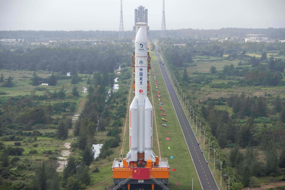 This photo taken on November 17, 2020, shows the Long March 5 rocket, which will launch China's Chang'e-5 lunar probe on November 24, being vertically transported to the launching area at the Wenchang Spacecraft Launch Site in southern China's Hainan prov