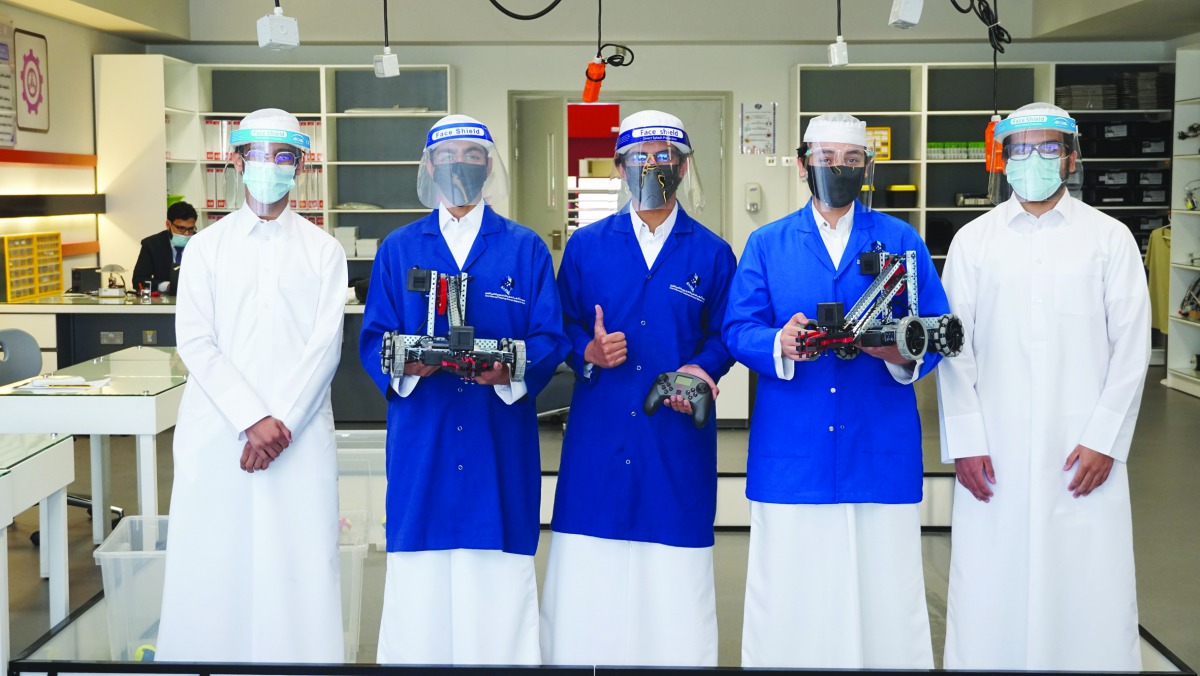 Participating students at the FIRST Global Challenge pose with their invention.