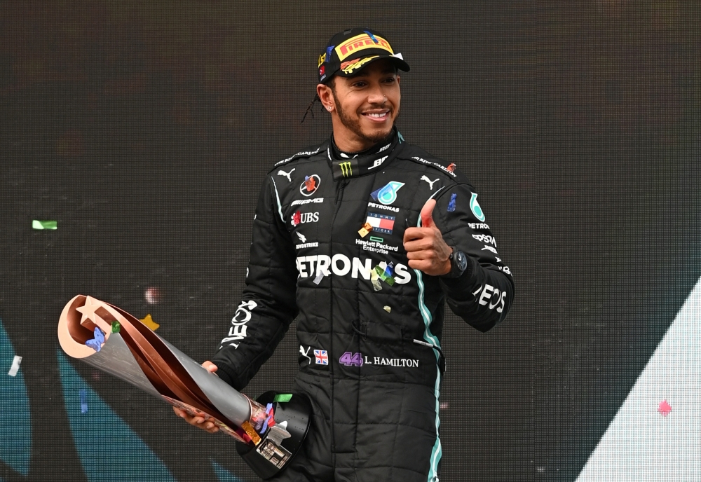 November 15, 2020 Mercedes' Lewis Hamilton celebrates on the podium with a trophy after winning the race and the world championship Pool via REUTERS/Ozan Kose/File Photo