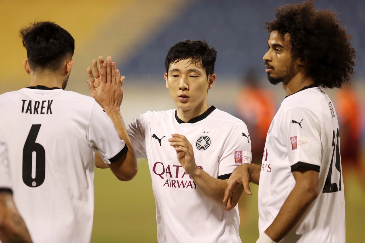 Al Sadd's Akram Afif (right) celebrates a goal with team-mates during QSL match against Umm Salal, yesterday. 