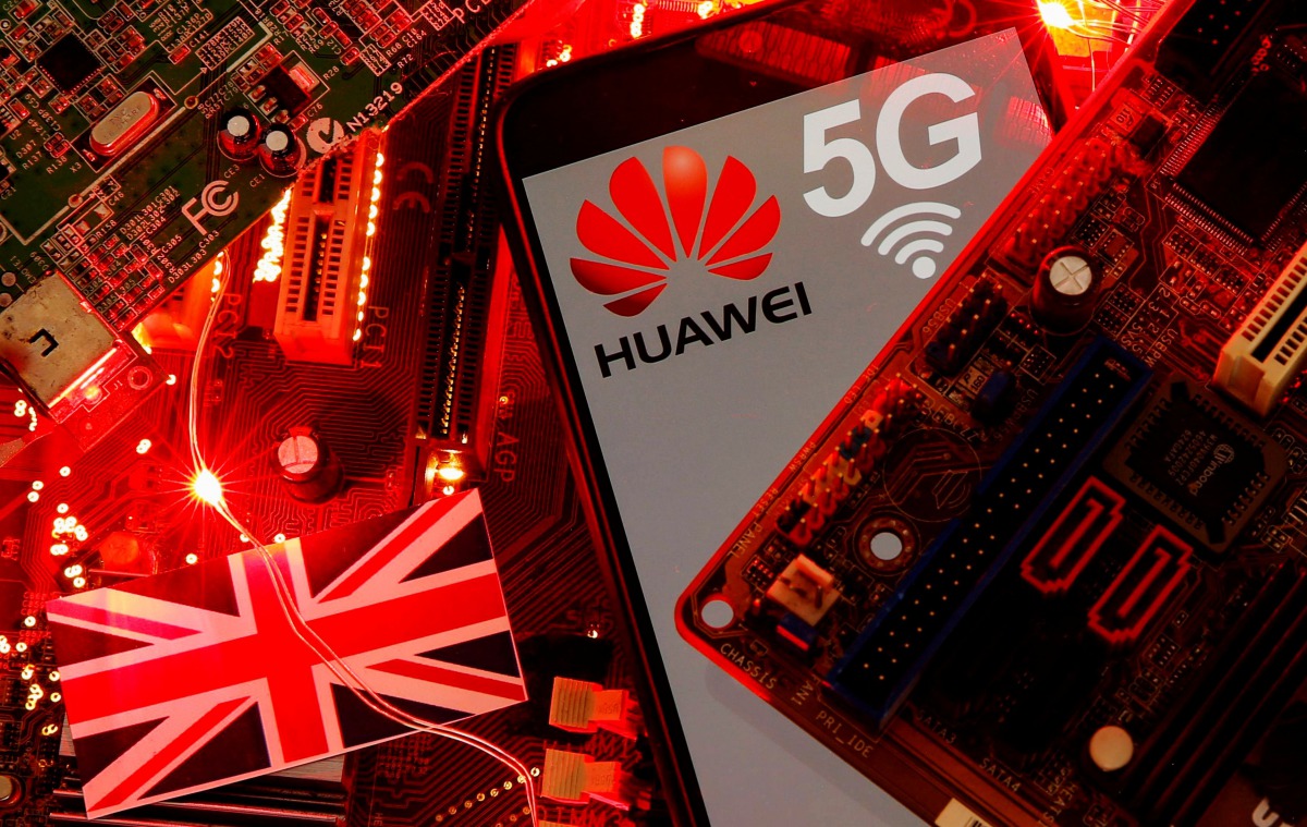 FILE PHOTO: The British flag and a smartphone with a Huawei and 5G network logo are seen on a PC motherboard in this illustration picture taken January 29, 2020. REUTERS/Dado Ruvic/Illustration/File Photo
