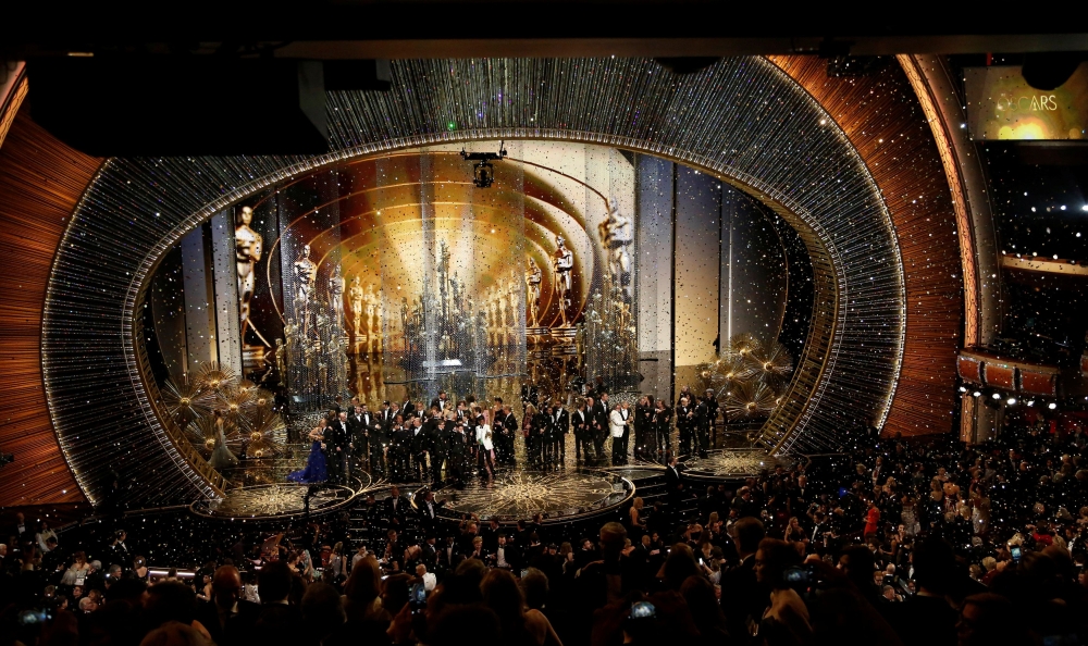 Oscar winners gather on stage after the end of the awards ceremony at the 88th Academy Awards in Hollywood, California February 28, 2016. REUTERS/Mario Anzuoni/File Photo