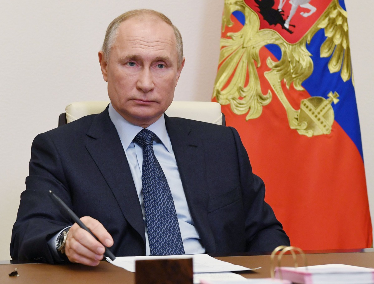 Russian President Vladimir Putin attends a ceremony to launch a new pharmaceutical substance large-scale production department at the Bratskkhimsintez plant of Russian drugmaker Pharmasyntez, via video link at Novo-Ogaryovo state residence, outside Moscow