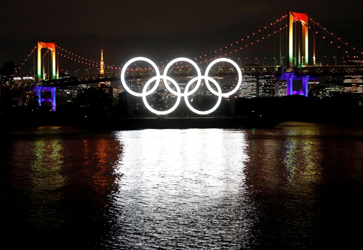 FILE PHOTO: The giant Olympic rings which were temporarily taken down in August for maintenance are illuminated after being reinstalled at the waterfront area at Odaiba Marine Park, amid the coronavirus disease (COVID 19) outbreak, in Tokyo, Japan Decembe