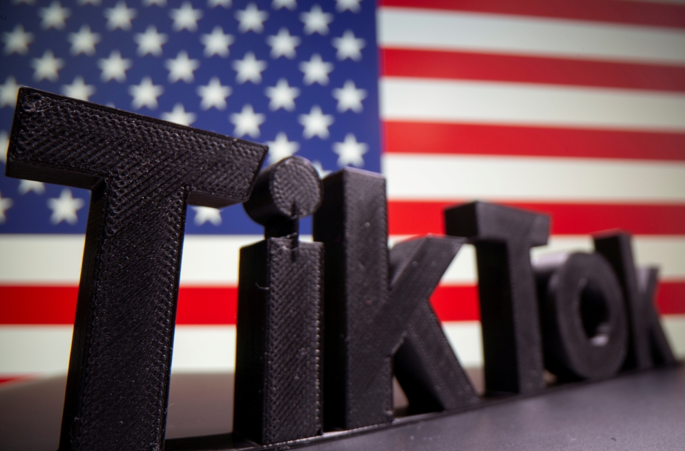 File photo: A 3D printed Tik Tok logo is seen in front of US flag in this illustration taken October 6, 2020. Reuters/Dado Ruvic/Illustration/File Photo