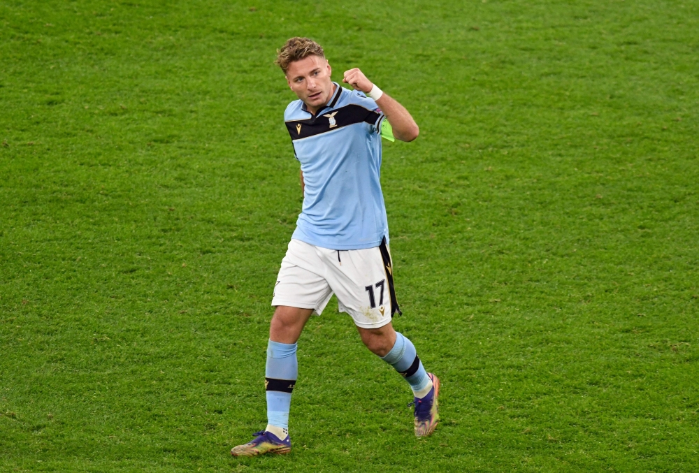 Lazio's Italian forward Ciro Immobile celebrates scoring a penalty during the UEFA Champions League group F football match BVB Borussia Dortmund v Lazio in Dortmund, western Germany, on December 2, 2020. / AFP / POOL / Bernd Thissen