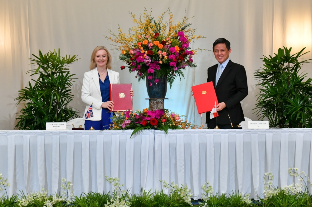 Britain’s trade minister Liz Truss and Singapore's trade minister Chan Chun Sing sign a free trade agreement in Singapore December 10, 2020. 